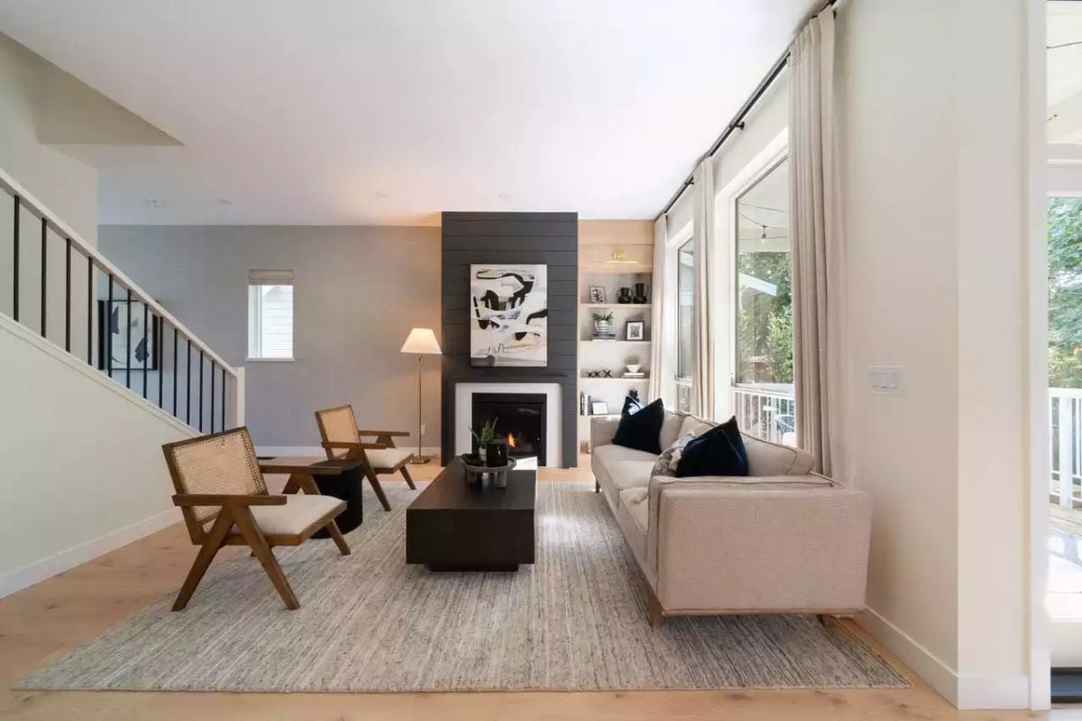 Dark Shiplap Fireplace Wall Anchors a Warm, Neutral Living Room