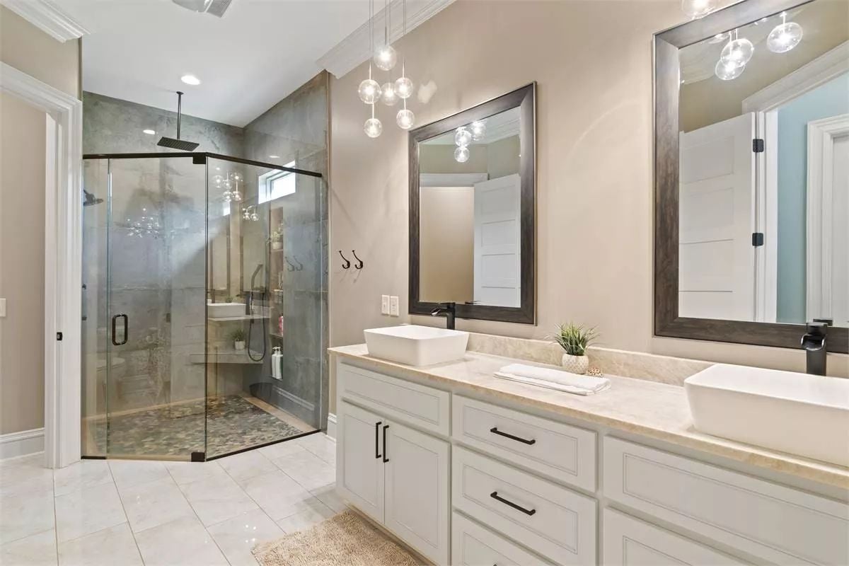 Vessel Sinks and Globe Pendants Bring Warmth to This Double Vanity Bath