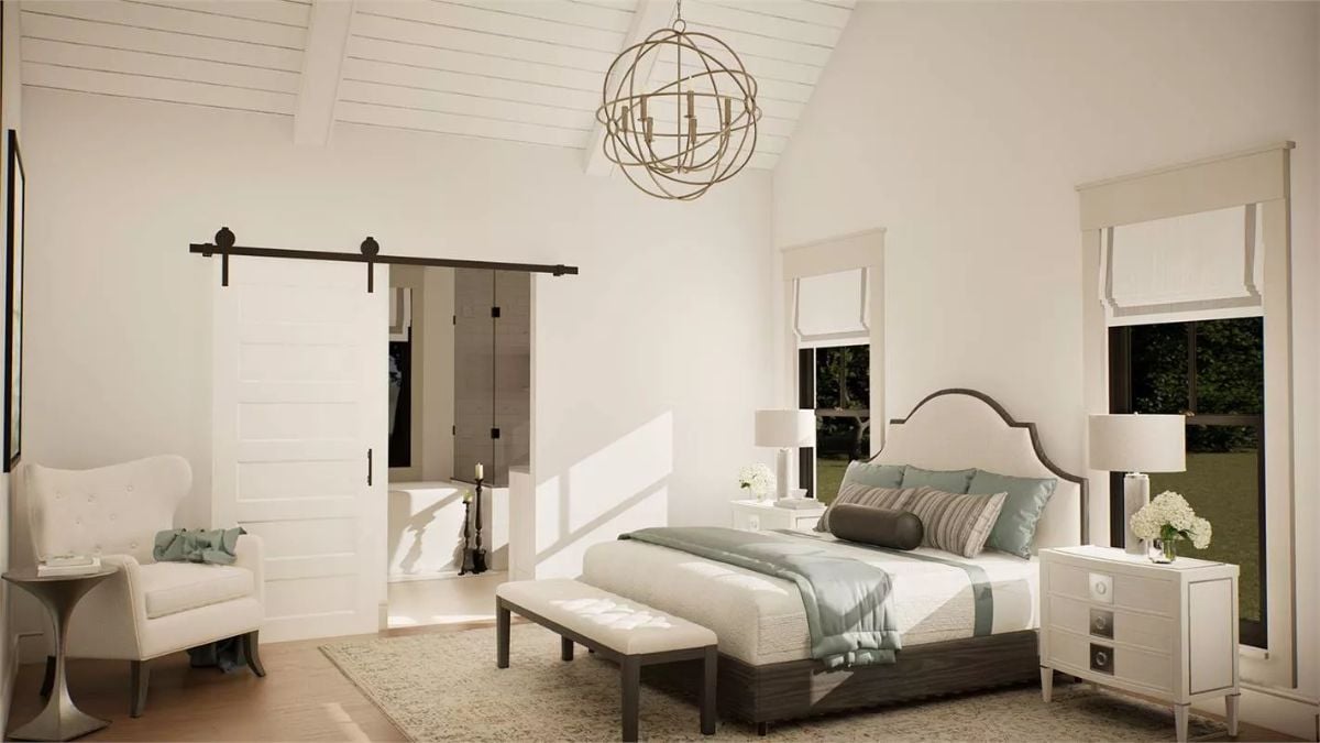 Orb Chandelier and Barn Door Bring Character to the Primary Bedroom