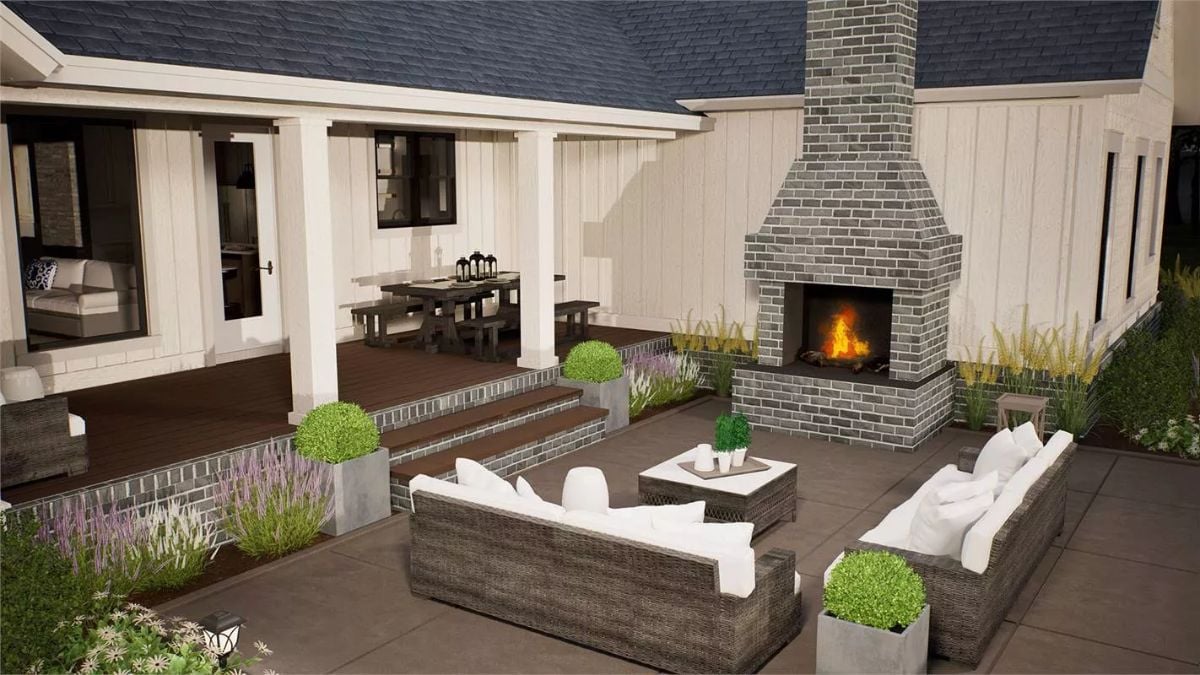 Brick Outdoor Fireplace and Wicker Seating Create a Backyard Living Room