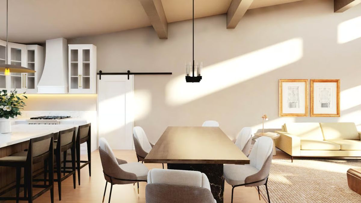 Exposed Ceiling Beams and a Barn Door Anchor This Open-Plan Dining Space