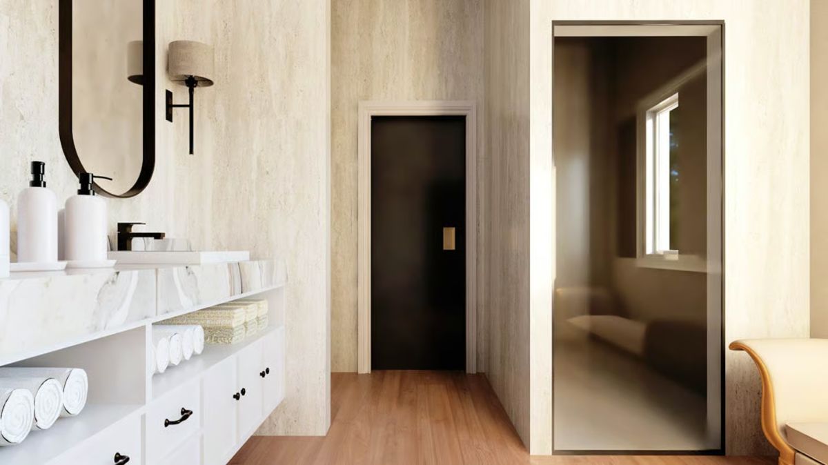 Black Door Hardware and Rolled Towels Bring Quiet Order to This Bathroom Hallway