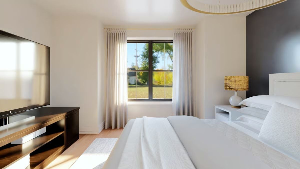 Contrast Wall and Rattan Lamp Give This Primary Bedroom Real Character