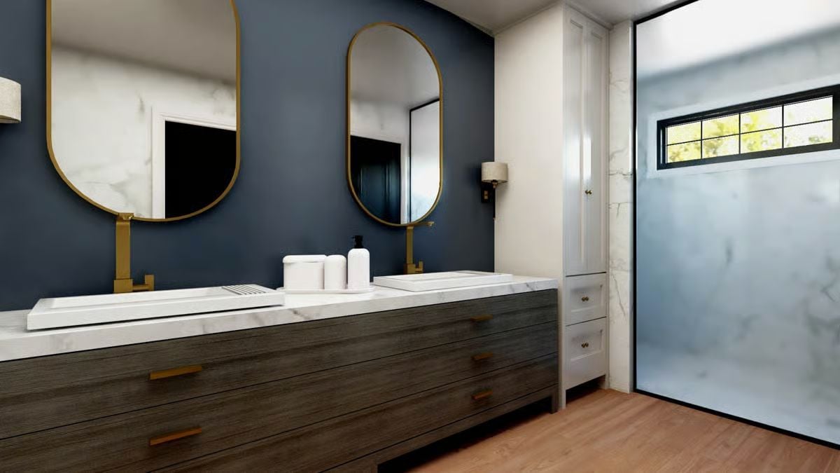 Gold Fixtures and Navy Walls Make This Double Vanity Hard to Ignore