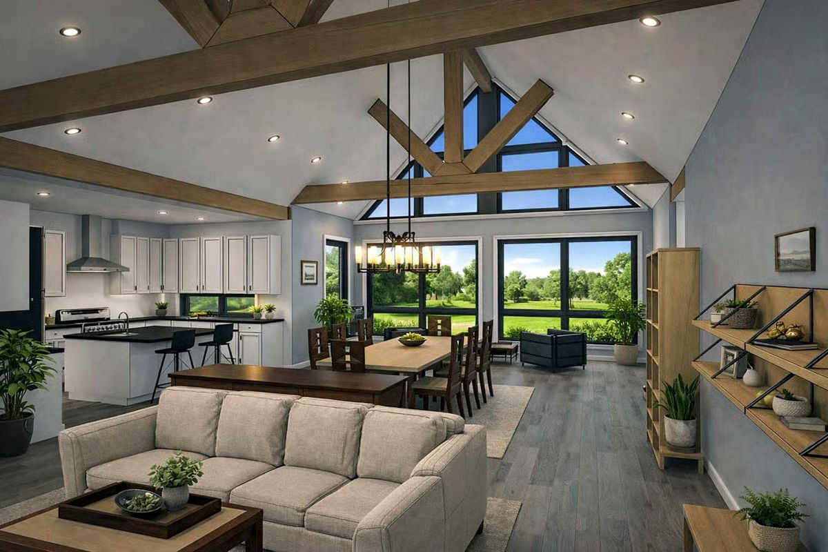 Vaulted Ceilings with Exposed Wood Trusses Anchor This Open-Concept Great Room