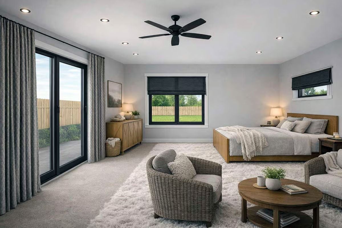 Wicker Seating and Warm Wood Tones Give This Primary Suite a Resort Feel