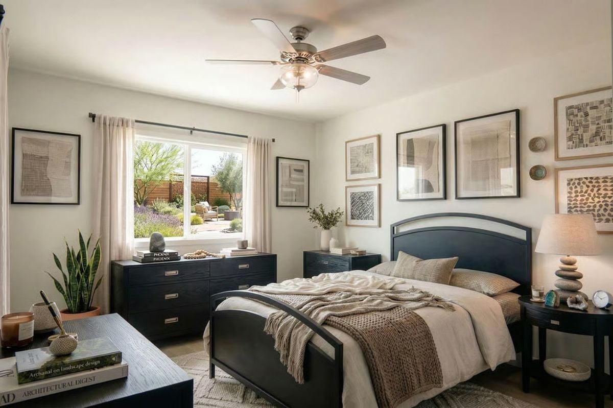 Navy Bed Frame and Gallery Wall Give a Small Bedroom Real Personality