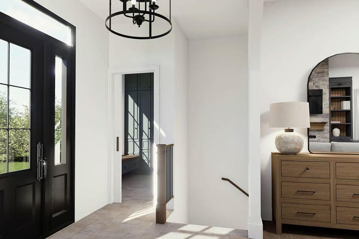 Black Iron Chandelier and Natural Wood Dresser Ground This Craftsman Entry