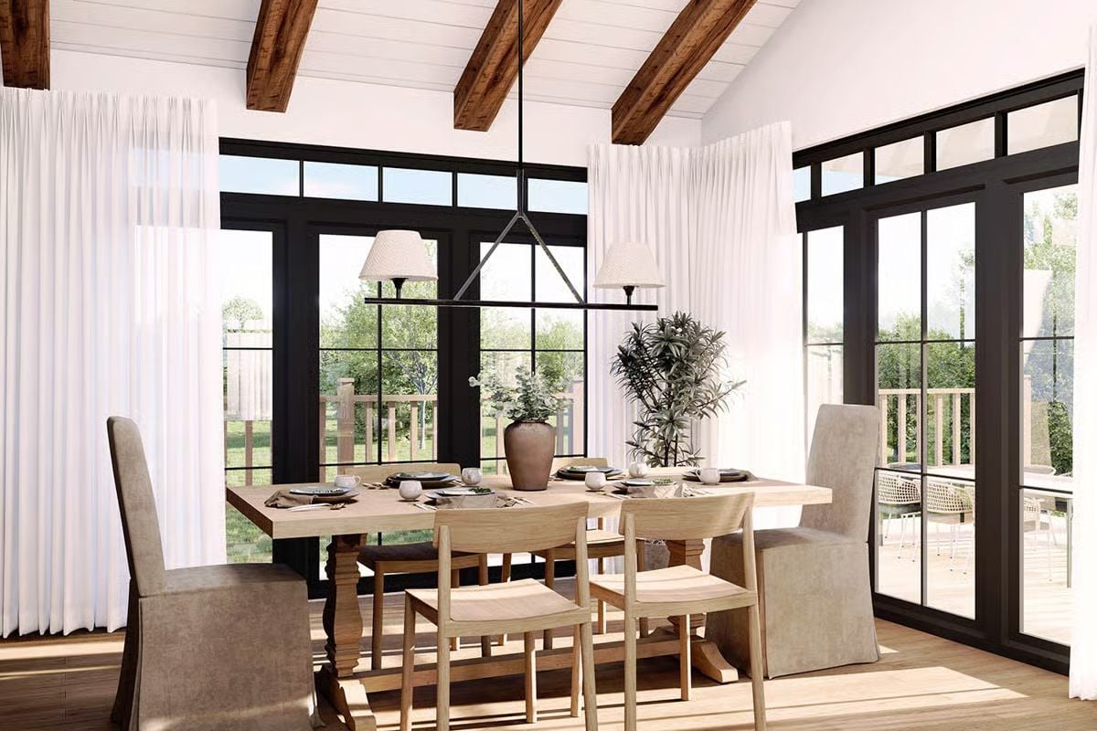 Exposed Beam Ceiling and Black-Frame Doors Define This Craftsman Dining Room