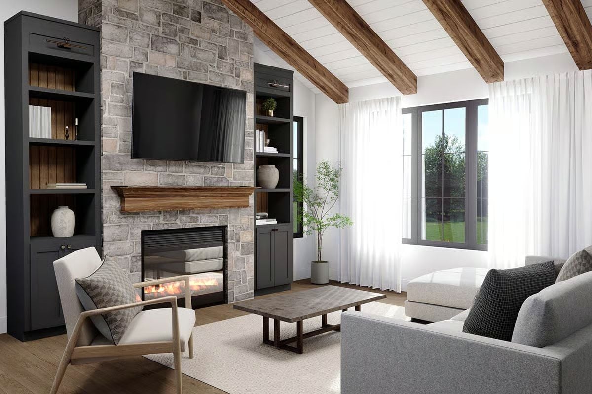 Stone Fireplace Wall and Exposed Ceiling Beams Anchor This Craftsman Living Room