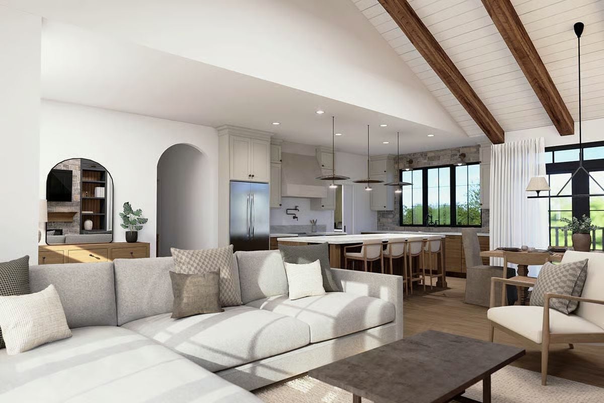 Vaulted Shiplap Ceiling and Arched Alcove Shape an Open-Concept Living Space