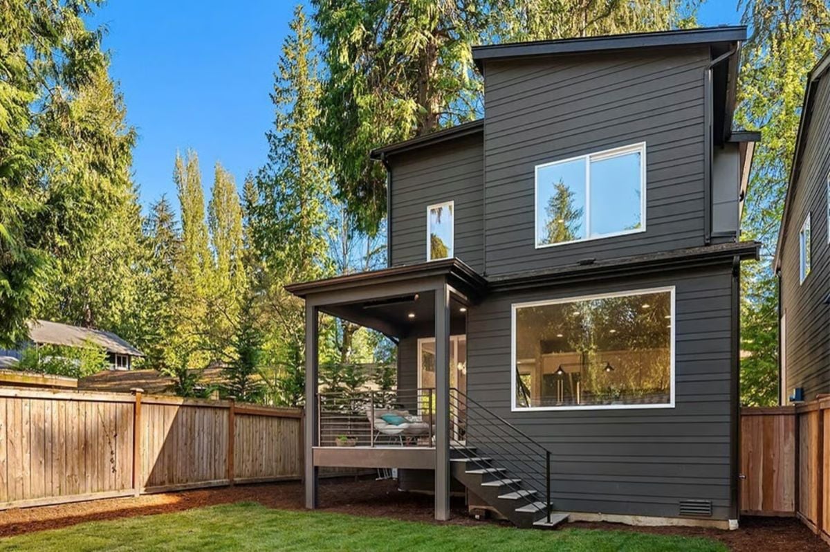 Dark Siding Meets a Covered Deck on This Two-Story Backyard Exterior
