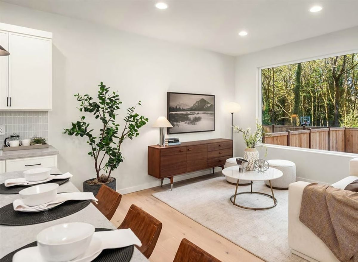 Mid-Century Credenza and Marble Coffee Table Anchor This Open Living Space