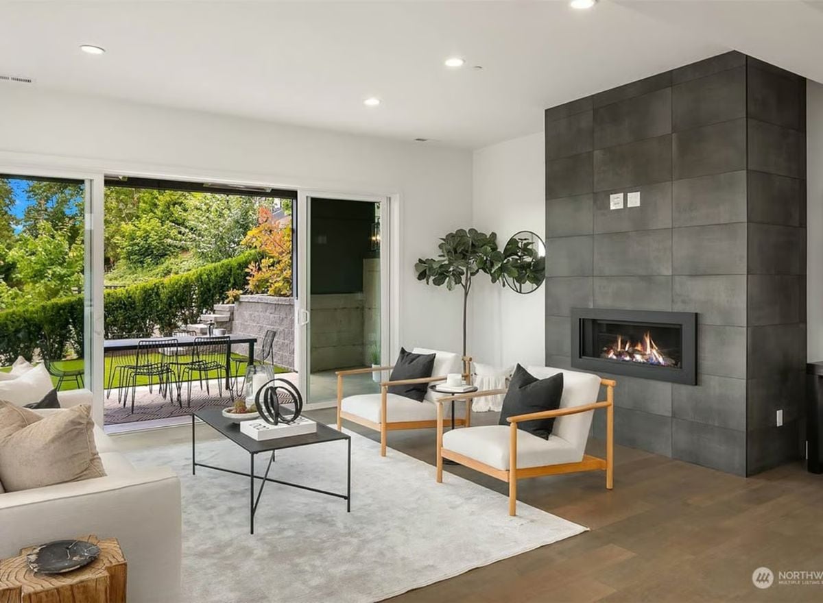 Slate Tile, Wood Frames, and a Linear Fireplace Built for Gathering