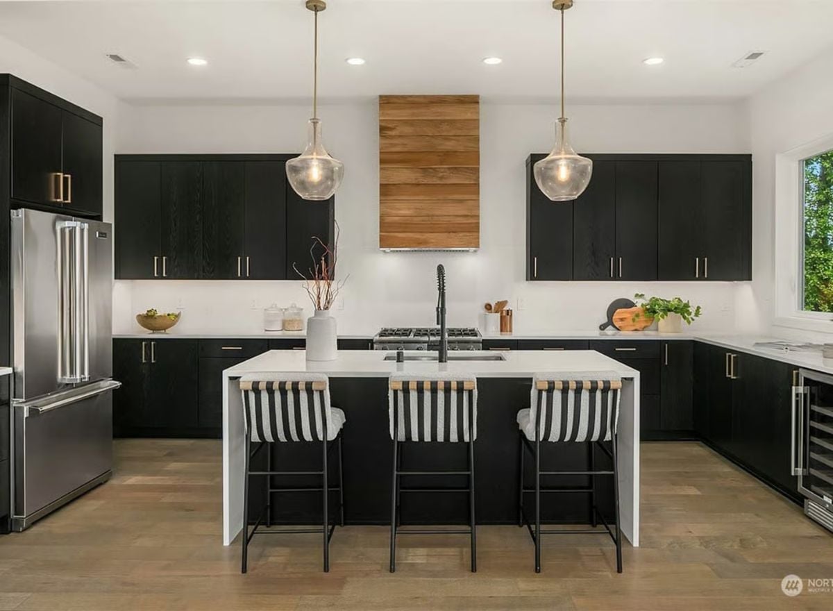 Black Cabinets, Wood Range Hood, and an Island Built for Three