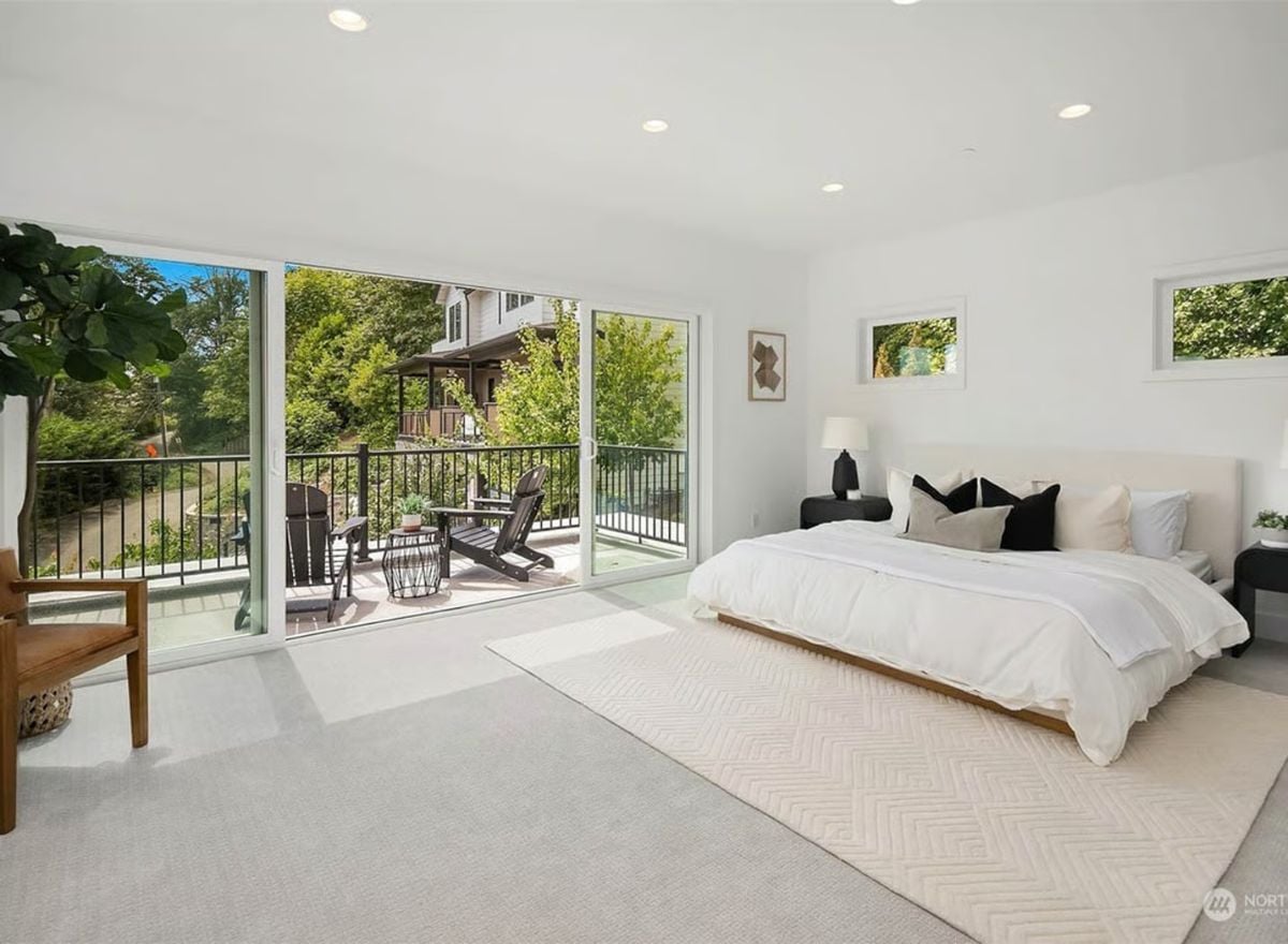 Sliding Glass, Carpet, and a Balcony That Pulls the Bedroom Outside