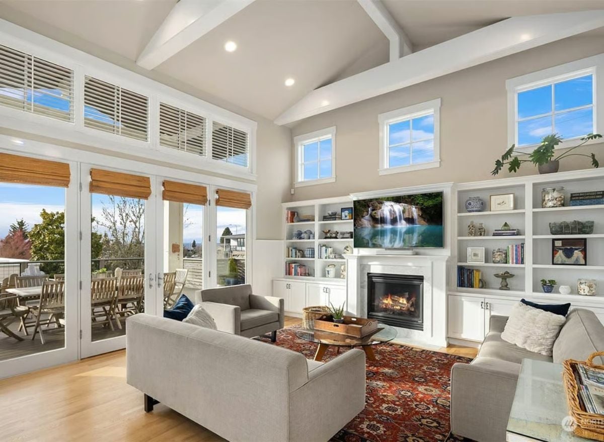 Vaulted Great Room with Built-Ins, Fireplace, and Deck Access