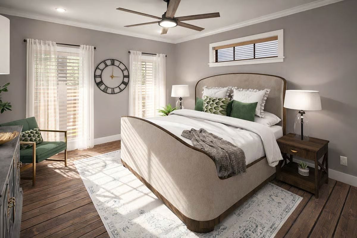 Upholstered Bed Frame and Green Accents Ground This Farmhouse Primary Bedroom