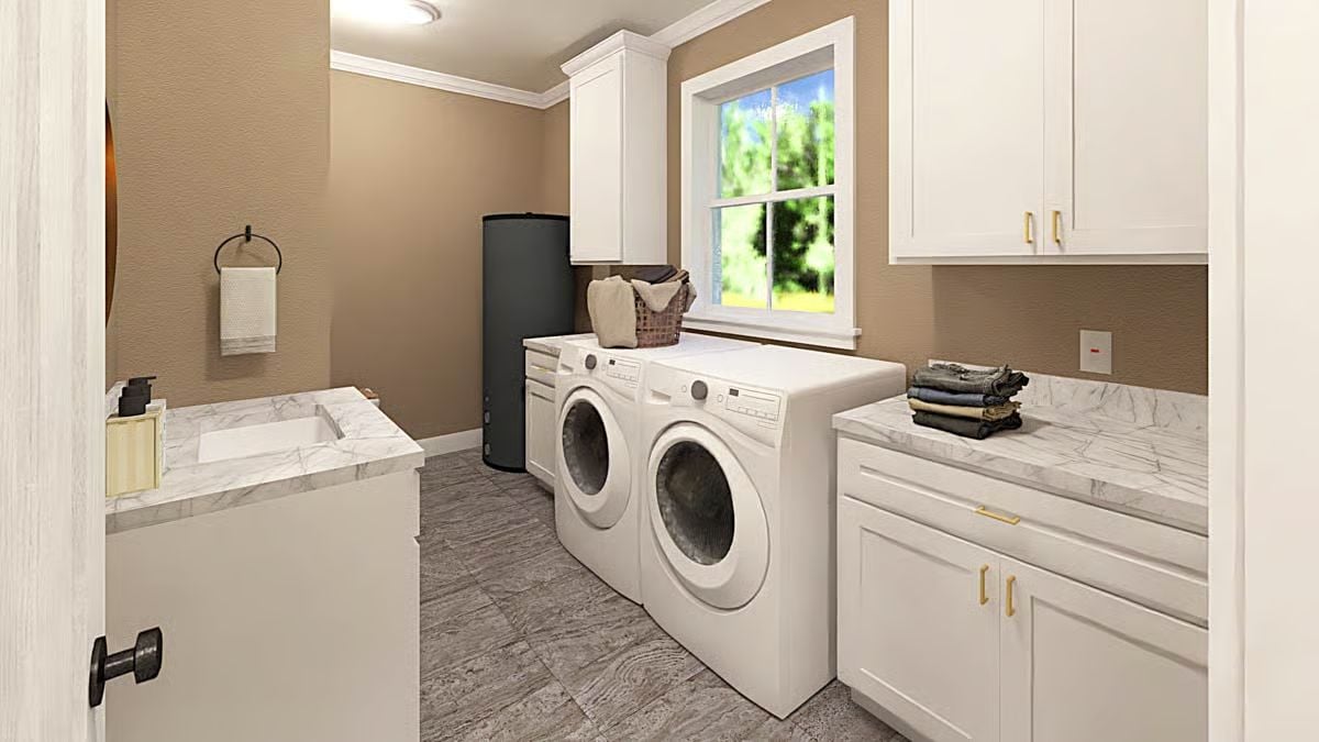 Gold Hardware and Folded Denim Add Warmth to This Farmhouse Laundry Room