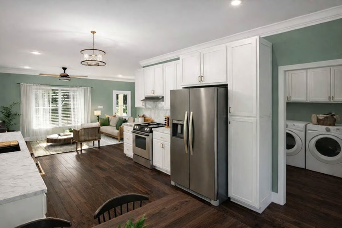 Stainless Appliances and Laundry Room Alcove Keep Function at the Forefront