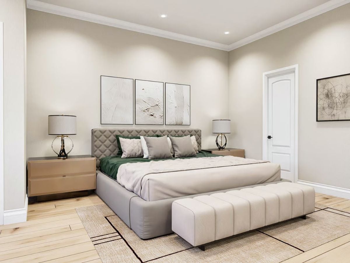 Quilted Headboard and Green Accents Anchor a Bedroom Built for Rest