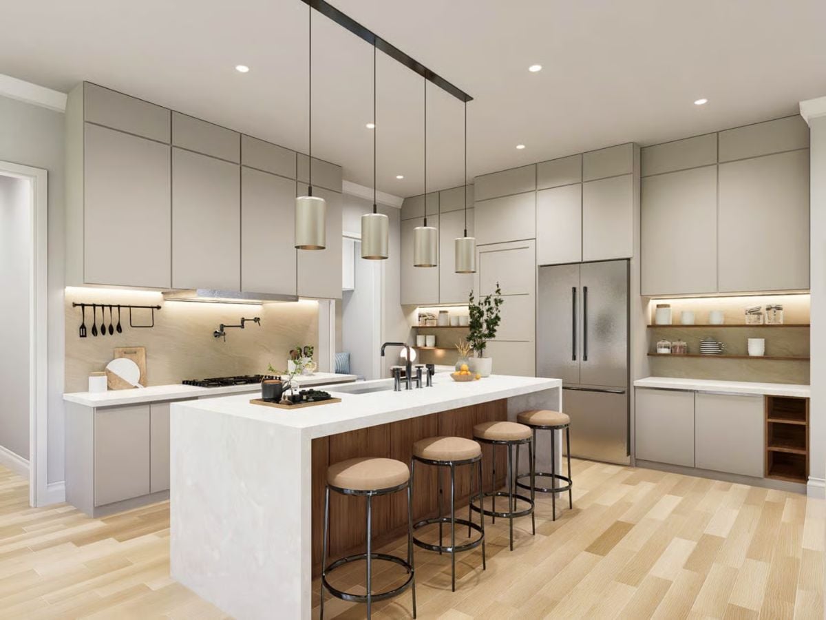 Warm Wood Tones and Quartz Countertops Ground a Modern Kitchen Island