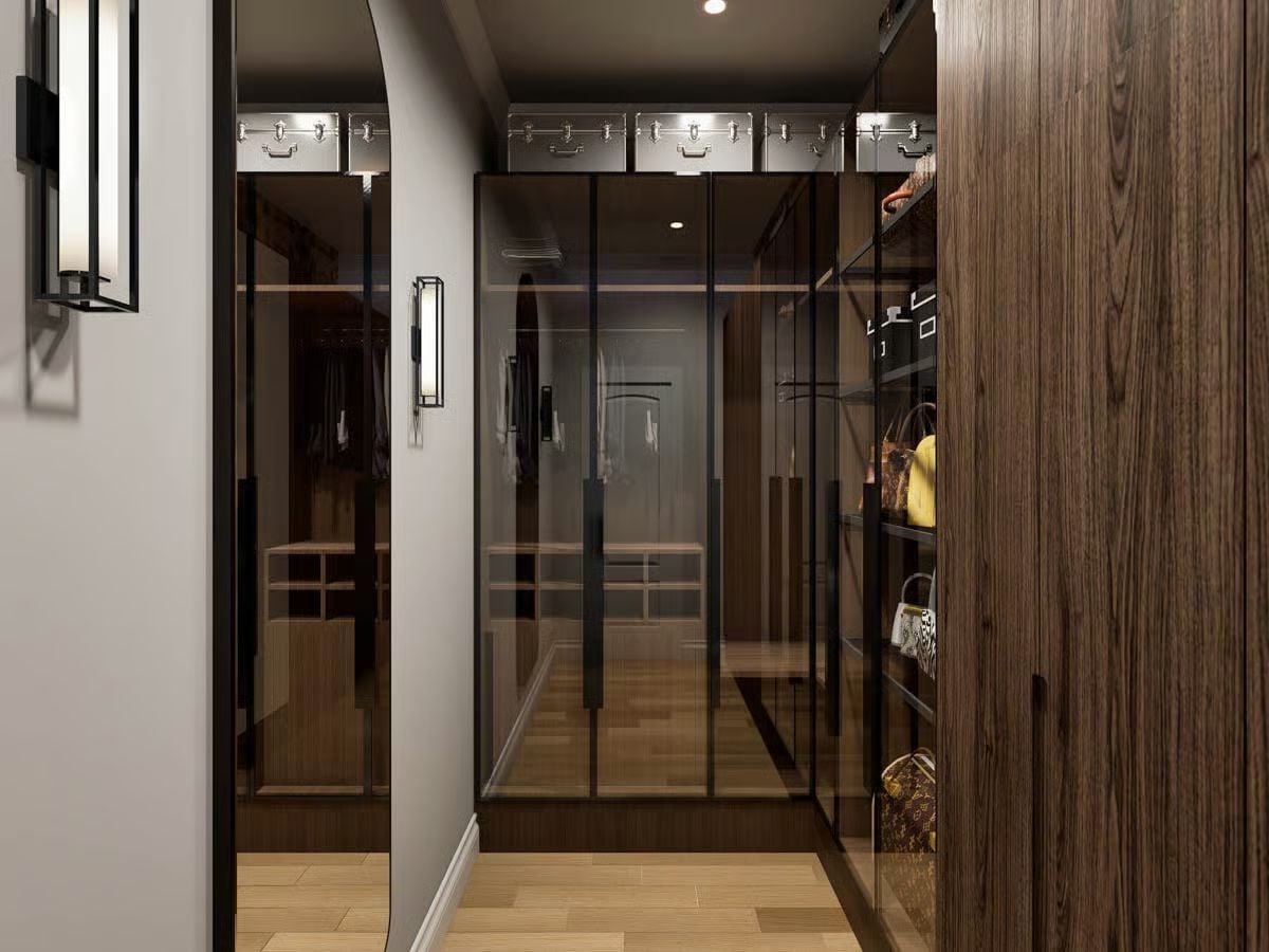 Smoked Glass Wardrobe Panels and Warm Wood Wrap a Walk-In Closet Built to Display