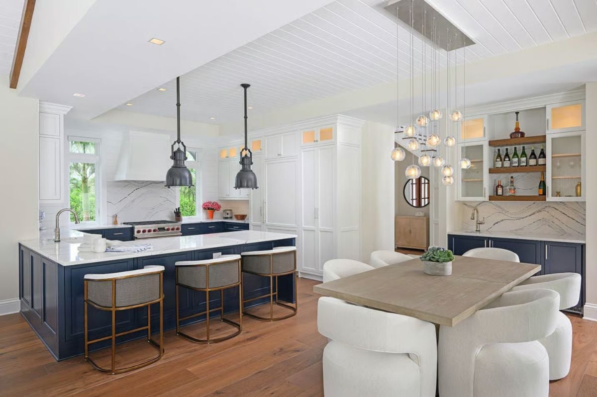 Navy Island Cabinetry and Globe Pendants Set the Tone in This Coastal Kitchen