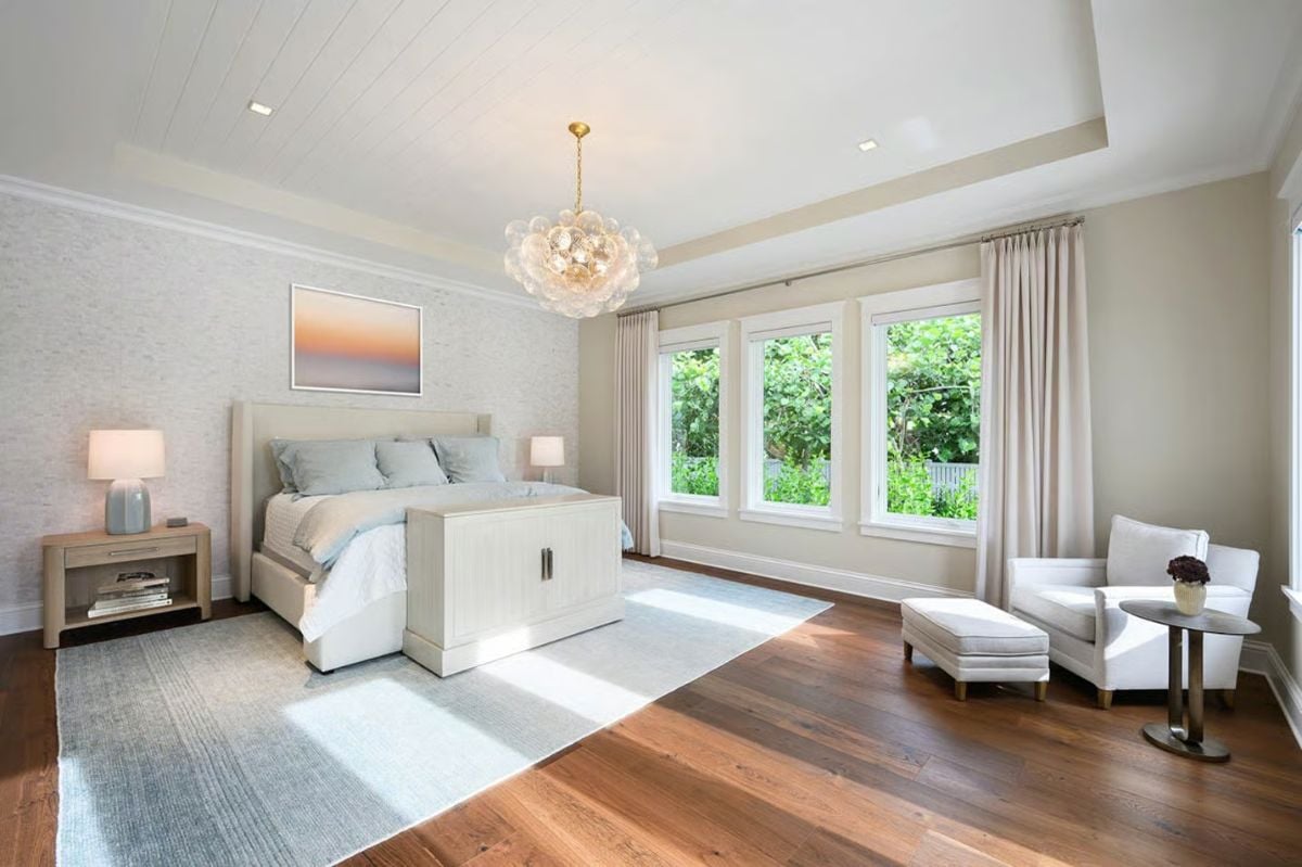 Bubble Chandelier and Warm Oak Floors Ground a Serene Primary Bedroom