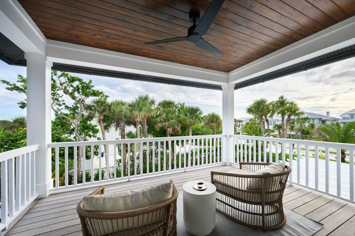 Covered Balcony Seating With Tongue-and-Groove Ceiling and Tropical Views