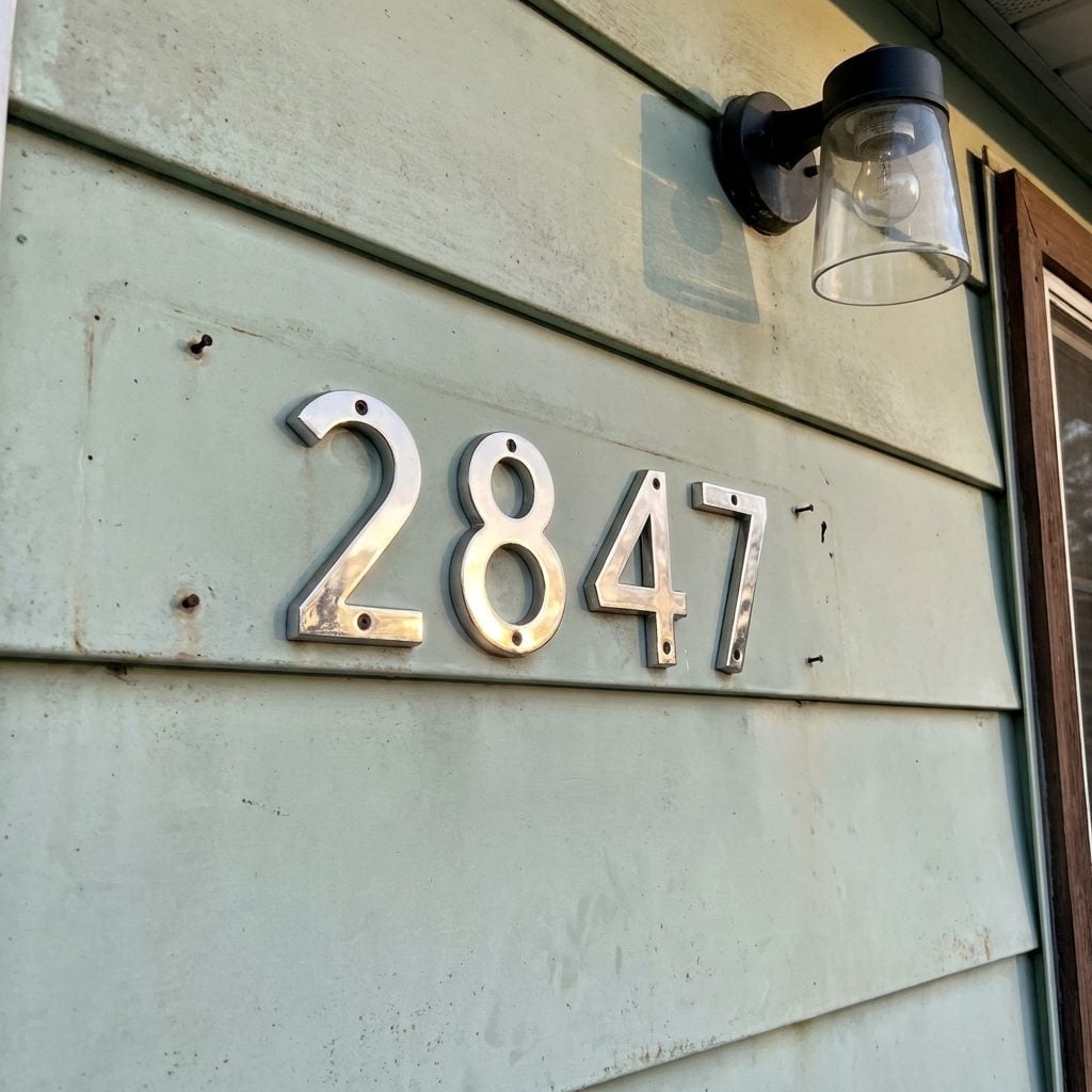 Reflective Metal House Numbers That Caught Your Headlights at Exactly the Right Moment