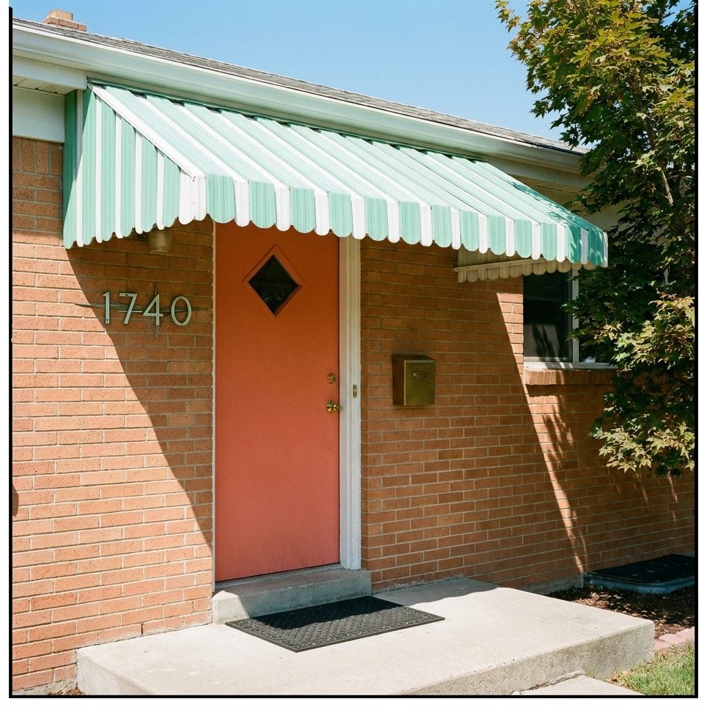 The Aluminum Awning With Scalloped Edges That Announced the Decade From the Street