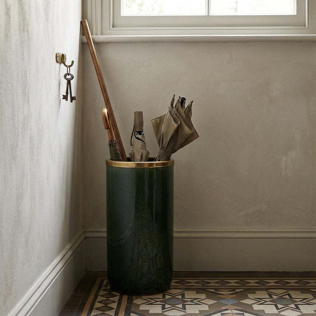 An Umbrella Stand by the Front Door With Umbrellas That Have Actually Dried Out in It
