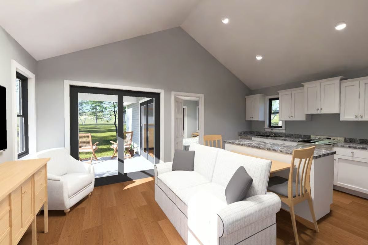 Vaulted Ceilings and an Open Kitchen Make a Narrow Plan Feel Generous