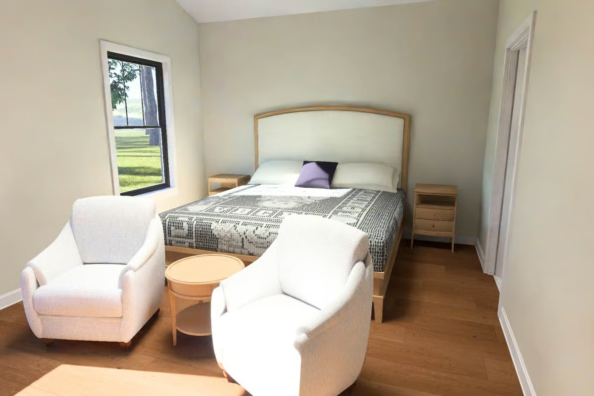 Paired Club Chairs and a Round Table That Earn Their Place in a Bedroom