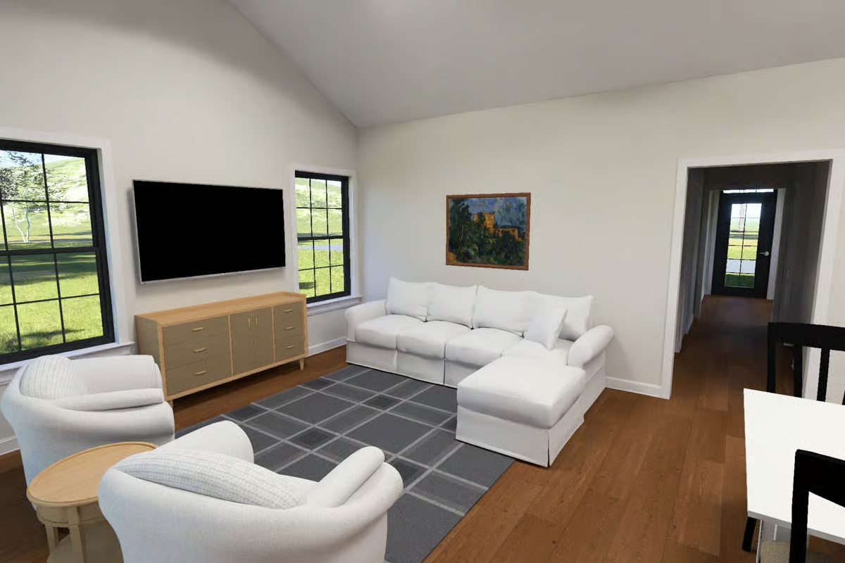 Slipcover Sofas and Warm Wood Floors Keep This Living Room Unpretentious