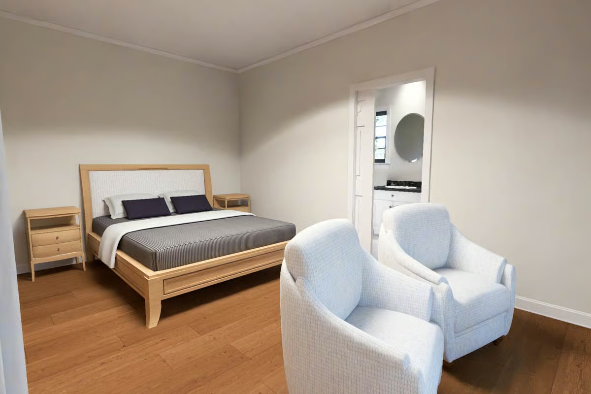 Light Linen Armchairs and Natural Oak Earn Their Keep in This Bedroom