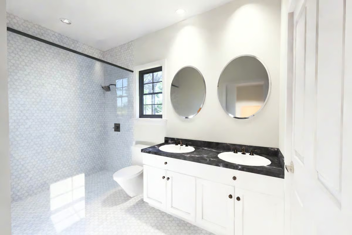 Black Marble Counters and Round Mirrors Make This Double Vanity Worth the Space