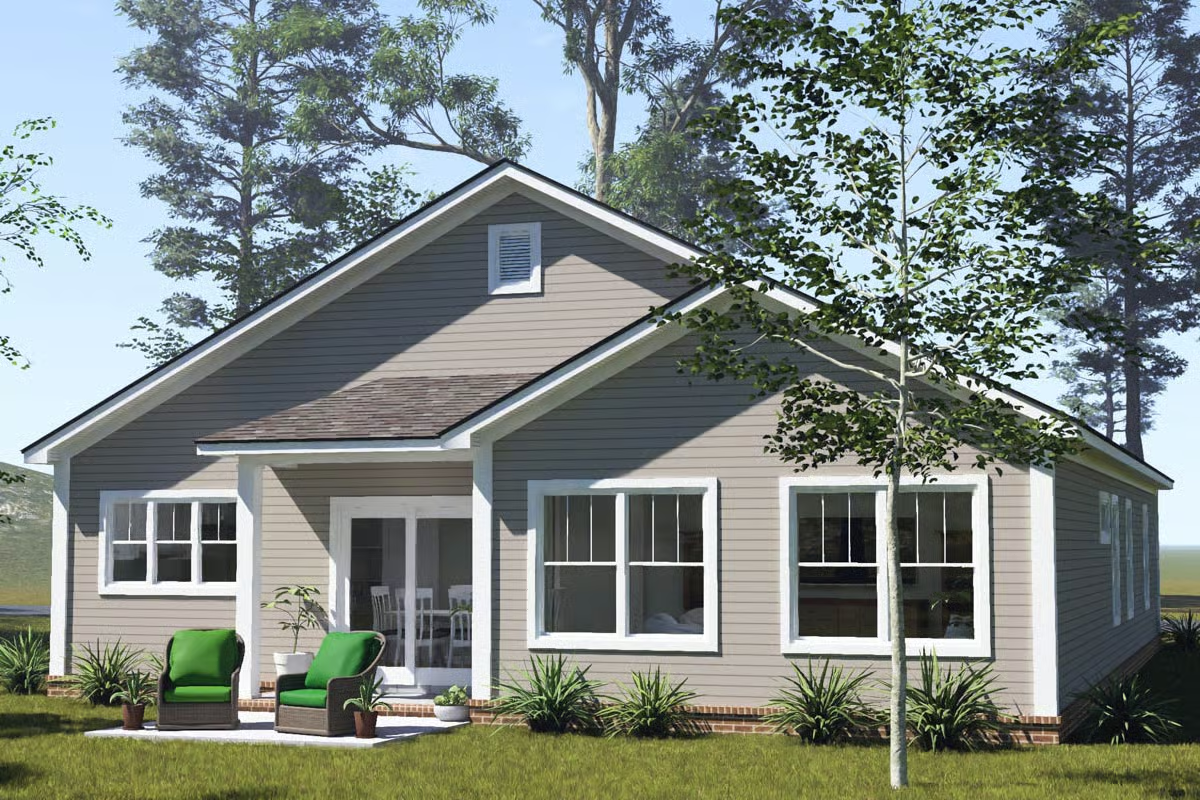 Covered Rear Patio With Green Seating Anchors This Compact Ranch Exterior