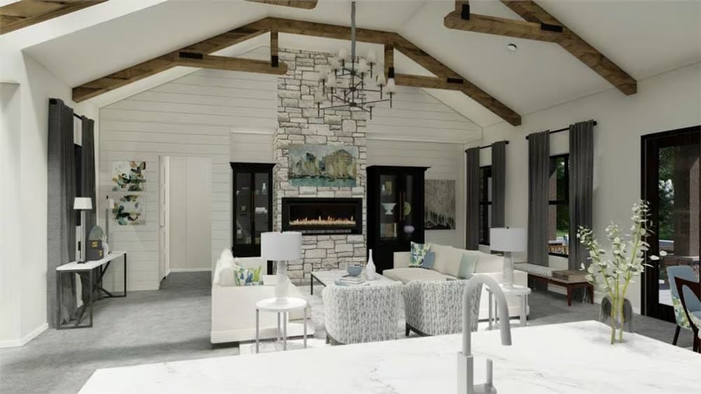 Vaulted Ceilings and a Stone Fireplace Tower Define the Living Room