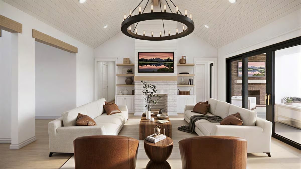 Leather Chairs and a Wagon-Wheel Chandelier Set the Tone Here