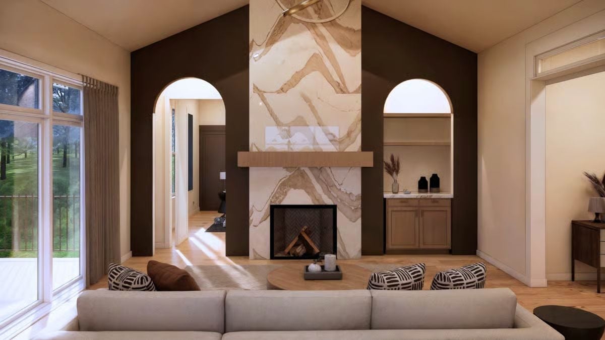 Floor-to-Ceiling Marble Surround Commands a Vaulted Living Room