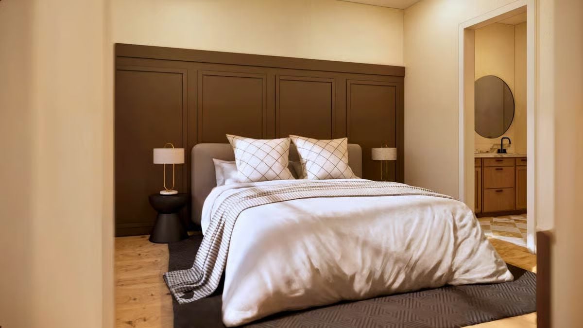 Wainscoting Panel Wall Grounds a Bedroom in Deep Warm Brown
