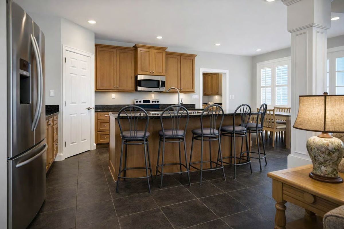 Dark Tile, Granite Counters, and Bar Seating for Four