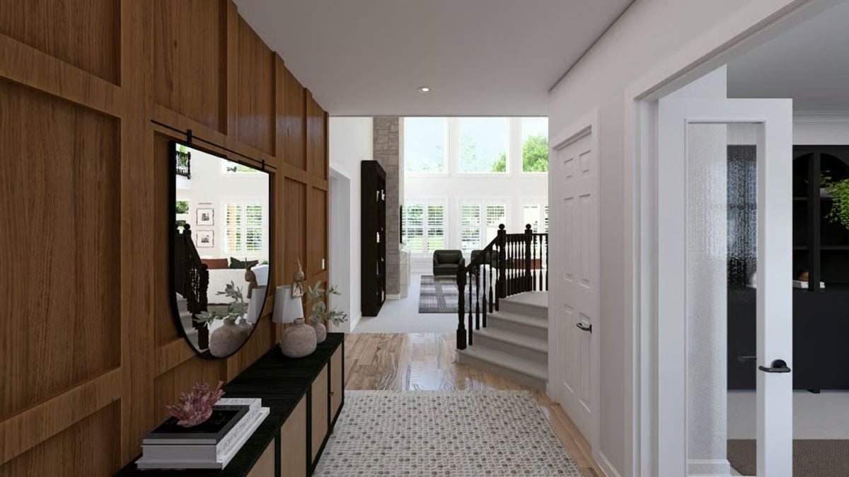 Wood-Paneled Entryway with Console Table and Round Mirror