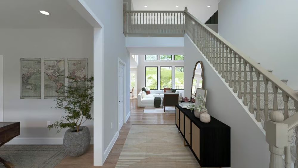 Grand Foyer with Two-Story Staircase and Open Sightlines to the Living Room