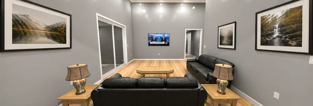 Matched Leather Sofas Face Off Across a Wood Coffee Table