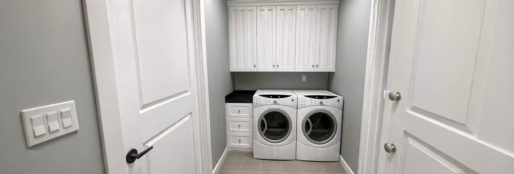 Stacked Cabinets and Side Drawers Make This Laundry Room Work Hard