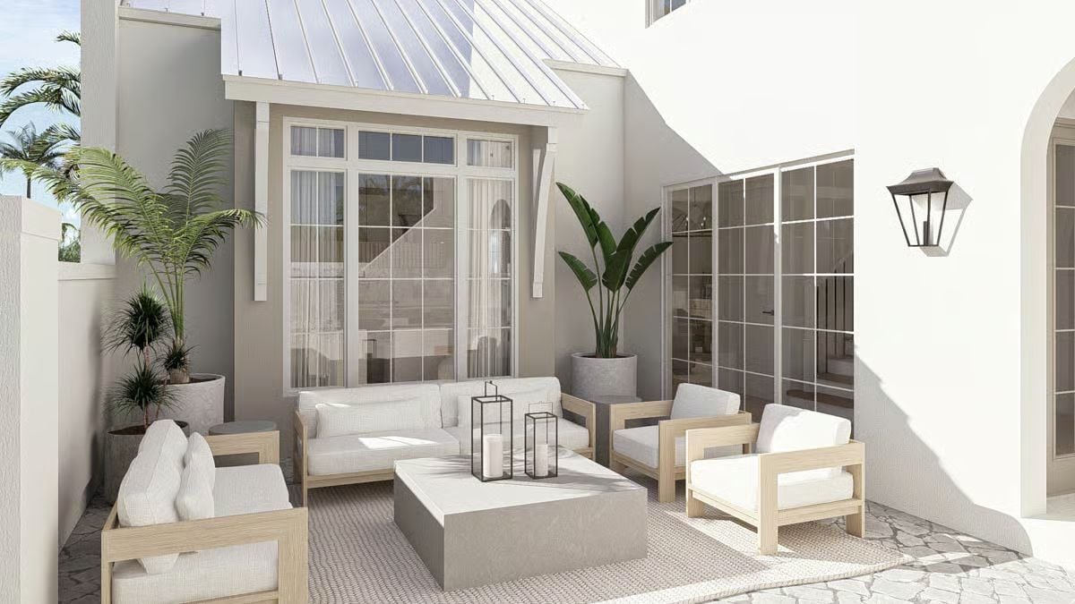 Outdoor Seating Built Around Wood Frames, White Cushions, and Candle Lanterns