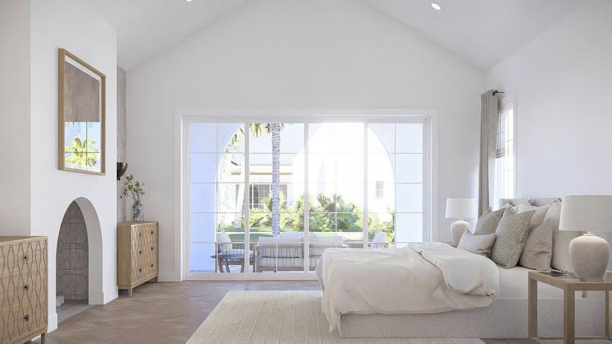 Vaulted Bedroom Opens to a Courtyard Through Floor-to-Ceiling Glass